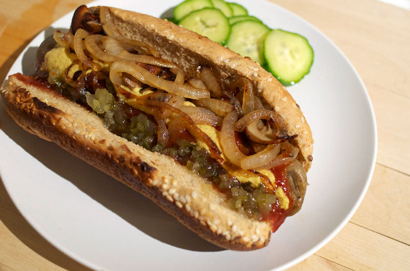 vegan beer brats with caramelized onions and mushrooms